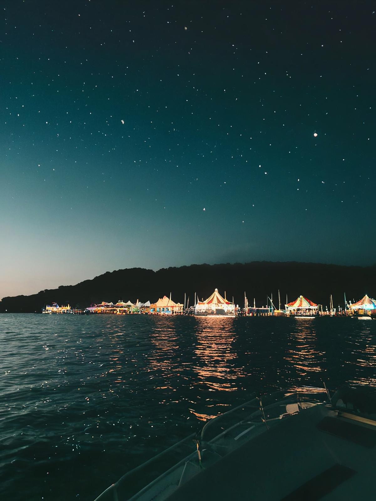Night view of a coastline with city lights